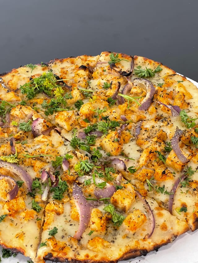 Fire-Kissed Chicken Alfredo Pizza.
